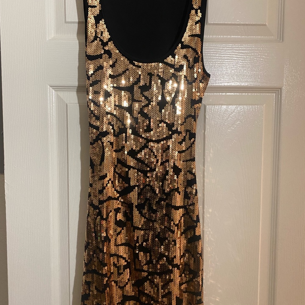 Beautiful short, black and gold sequin dress